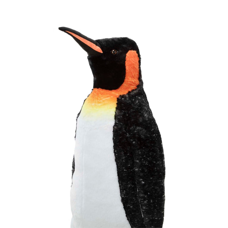 The loose pieces of the Melissa & Doug Giant Lifelike Plush Emperor Penguin Standing Stuffed Animal (3.4 Feet Tall)