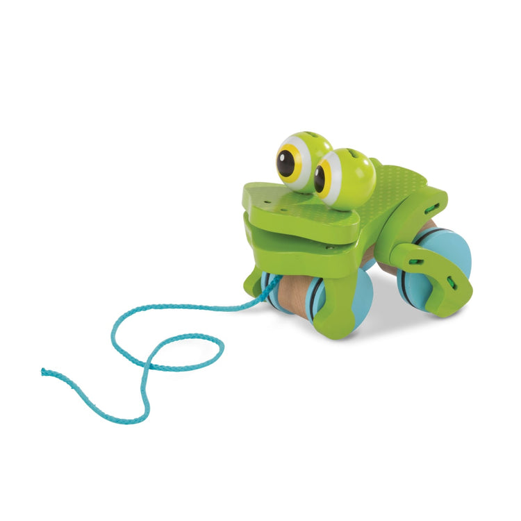 The loose pieces of the Melissa & Doug First Play Frolicking Frog Wooden Pull Toy