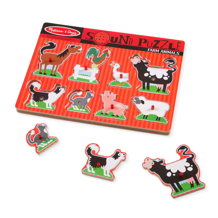The loose pieces of the Melissa & Doug Farm Animals Sound Puzzle - Wooden Peg Puzzle With Sound Effects (8 pcs)