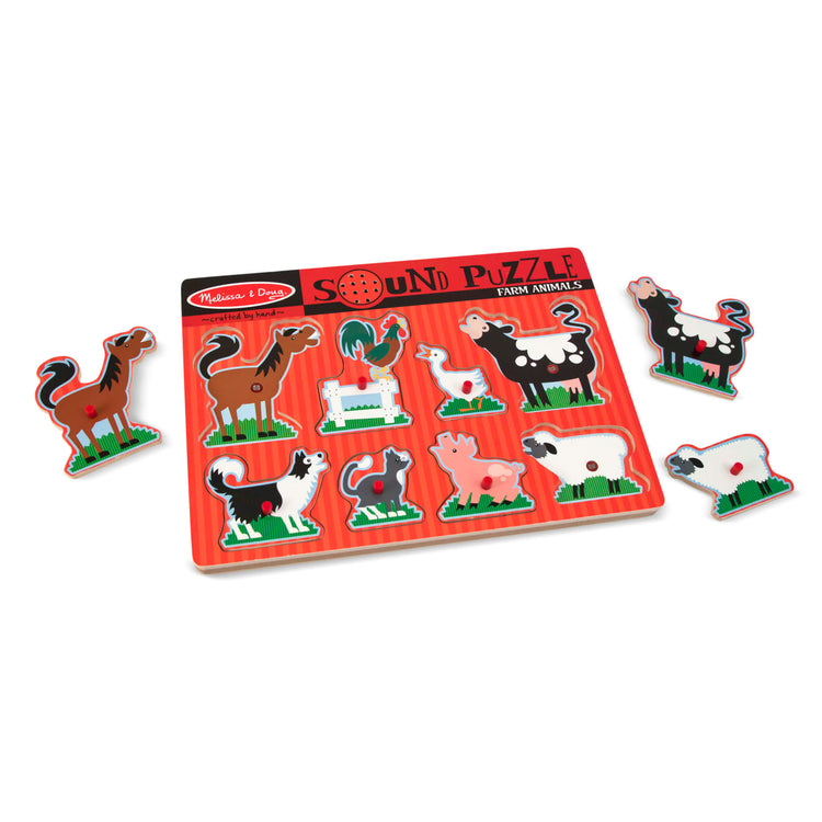 The loose pieces of the Melissa & Doug Farm Animals Sound Puzzle - Wooden Peg Puzzle With Sound Effects (8 pcs)