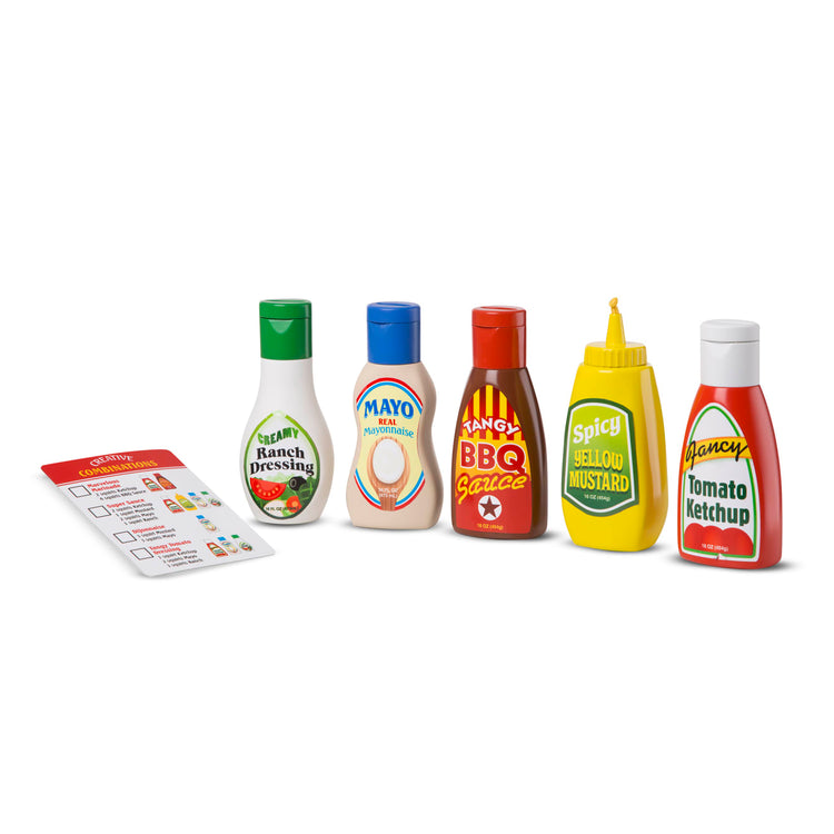 The loose pieces of the Melissa & Doug 5-Piece Favorite Condiments Play Food Set