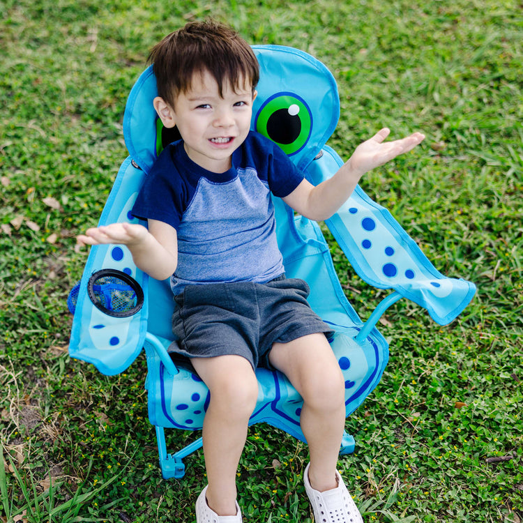 A kid playing with the Melissa & Doug Sunny Patch Flex Octopus Folding Beach Chair for Kids