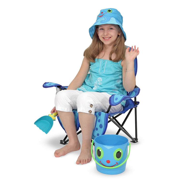 A child on white background with the Melissa & Doug Sunny Patch Flex Octopus Folding Beach Chair for Kids