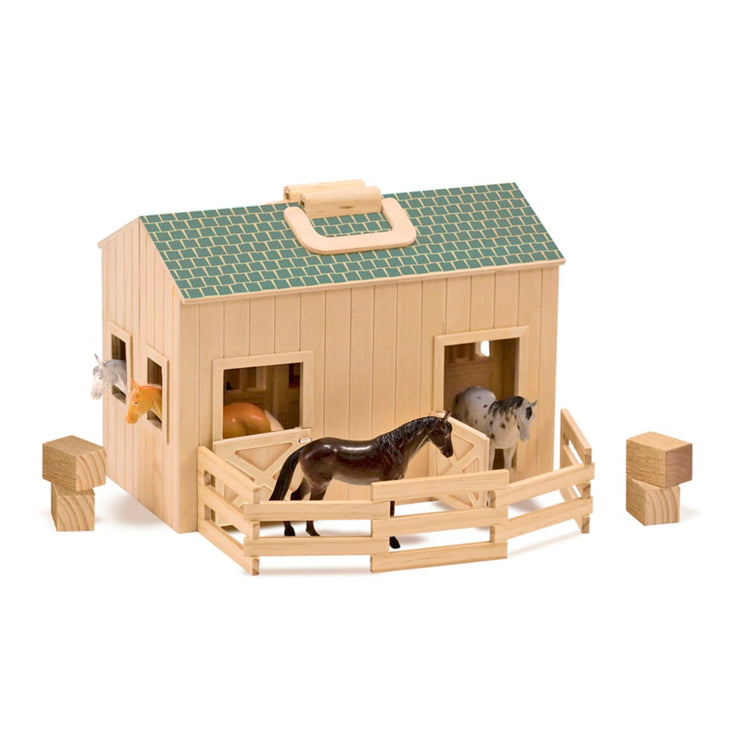 The loose pieces of the Melissa & Doug Fold and Go Wooden Horse Stable Dollhouse With Handle and Toy Horses (11 pcs)