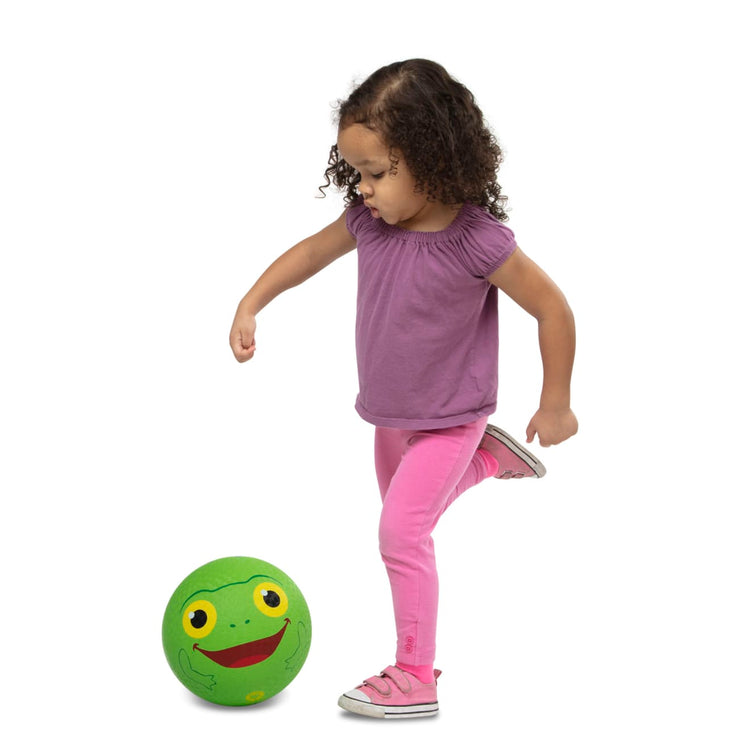 A child on white background with the Melissa & Doug Sunny Patch Froggy Classic Rubber Kickball