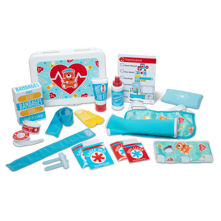 The loose pieces of the Melissa & Doug Get Well First Aid Kit Play Set – 25 Toy Pieces