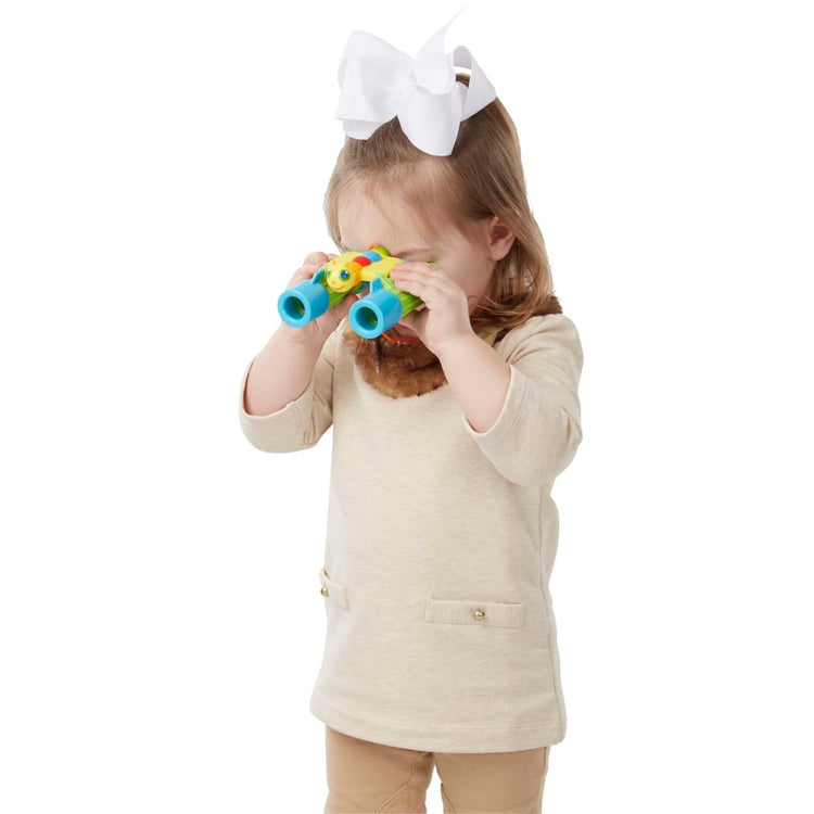 A child on white background with the Melissa & Doug Sunny Patch Giddy Buggy Binoculars - Pretend Play Toy