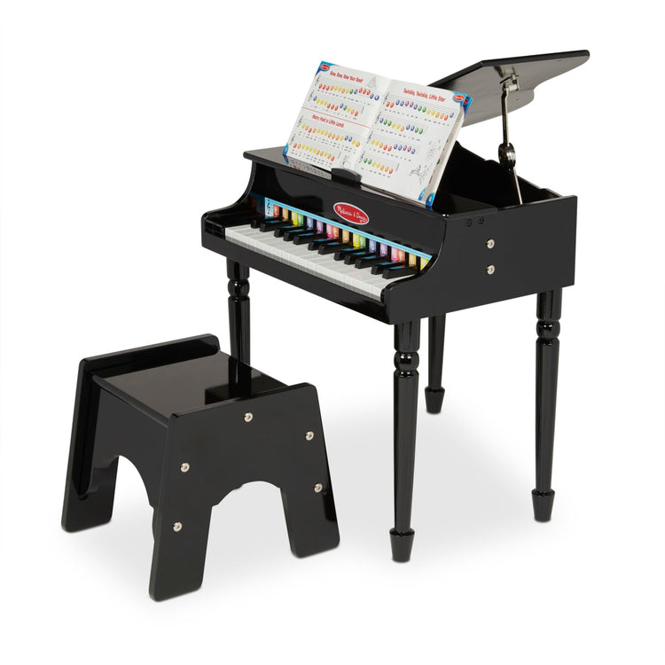 The loose pieces of the Melissa & Doug Learn-To-Play Classic Grand Piano With 30 Keys, Color-Coded Songbook, and Non-Tip Bench