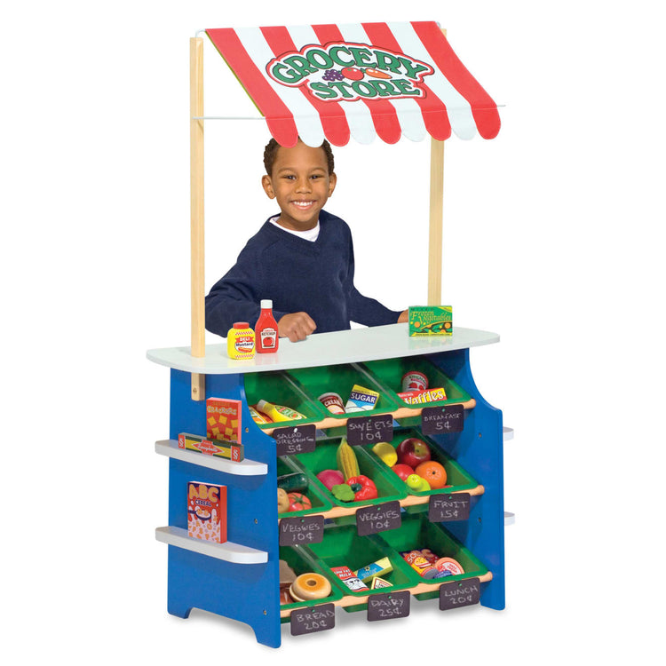 the Melissa & Doug Wooden Grocery Store and Lemonade Stand - Reversible Awning, 9 Bins, Chalkboards