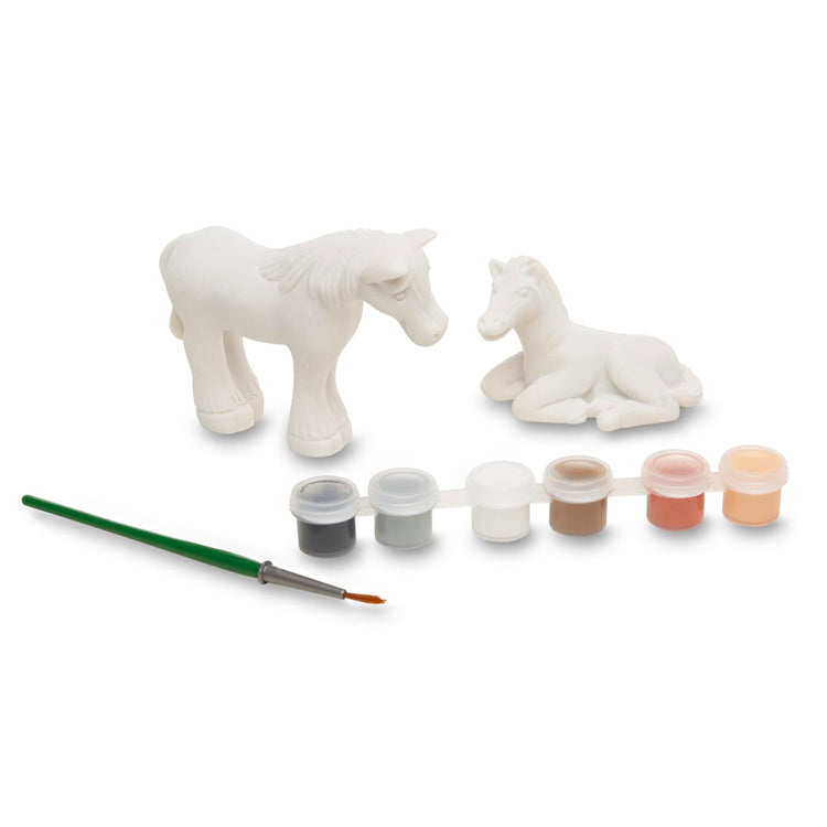 The loose pieces of the Melissa & Doug Created by Me! Horse Figurines Craft Kit (2 Resin Horses, 6 Paints, Paintbrush)