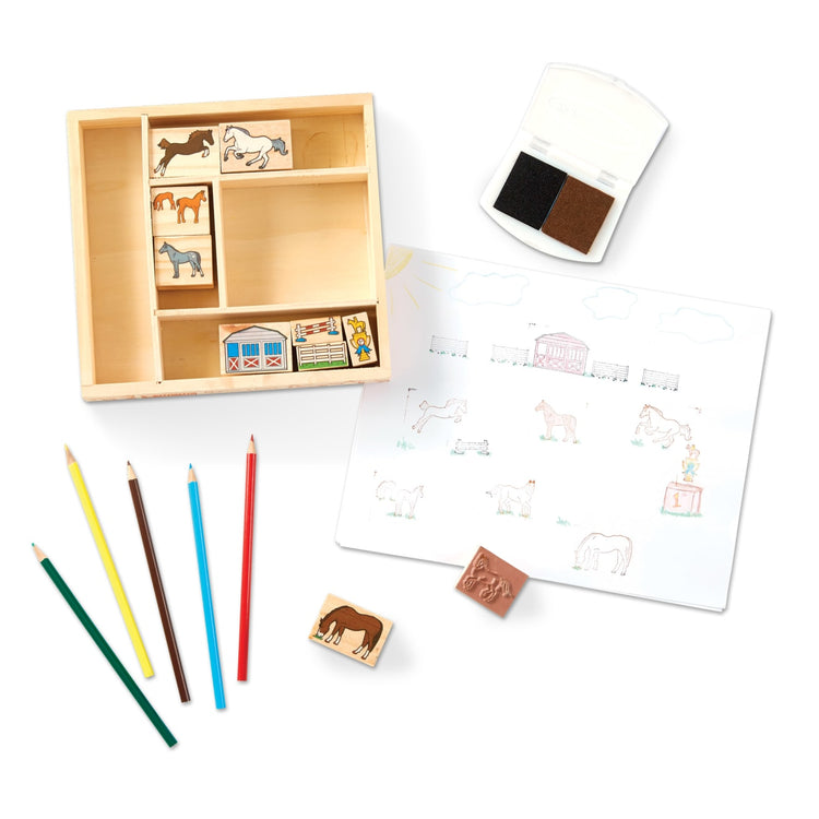 The loose pieces of the Melissa & Doug Wooden Stamp Activity Set: Horses - 10 Stamps, 5 Colored Pencils, 2-Color Stamp Pad
