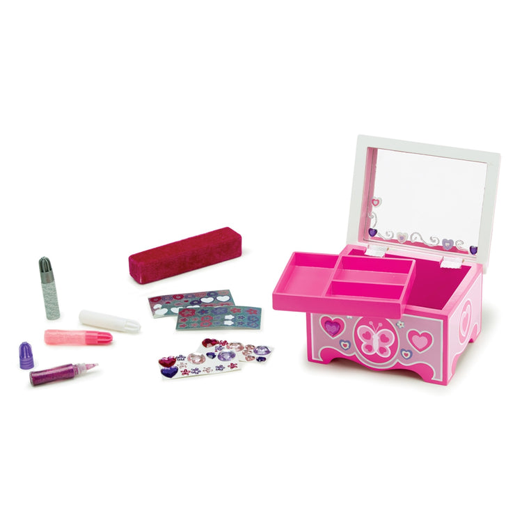 The loose pieces of the Melissa & Doug Created by Me! Jewelry Box Wooden Craft Kit