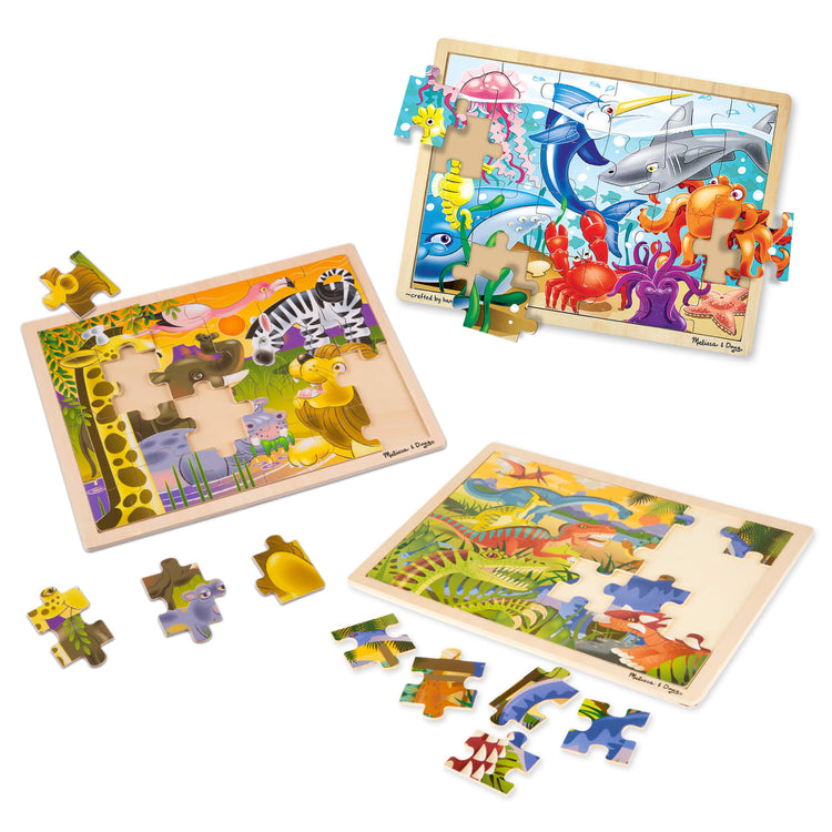 The loose pieces of the Melissa & Doug 24-Piece Wooden Jigsaw Puzzle 3-Pack -- Dinosaur, Safari and Ocean