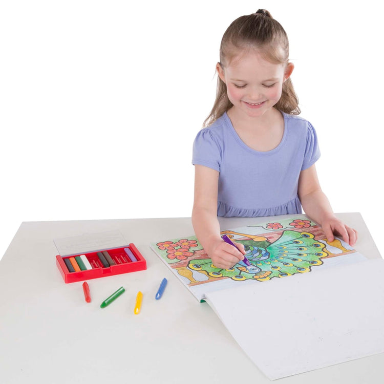 A child on white background with the Melissa & Doug Jumbo Coloring Pad (11 x 14 inches) - Animals, 50 Pictures