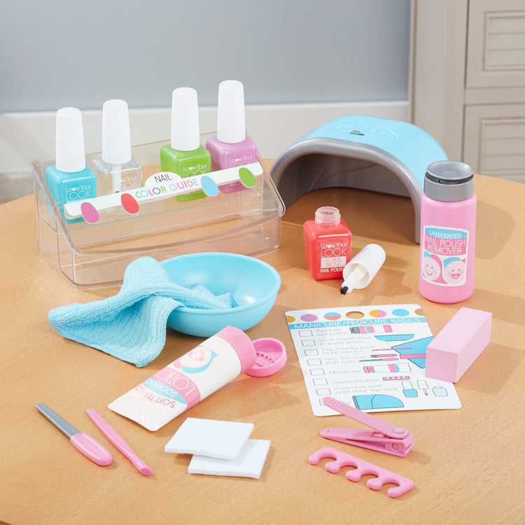 The front of the box for the Melissa & Doug Love Your Look Pretend Nail Care Play Set – 22 Pieces for Mess-Free Play Mani-Pedis (DOES NOT CONTAIN REAL COSMETICS)