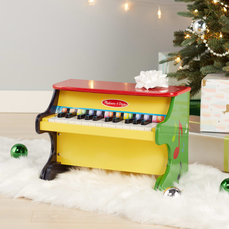 the Melissa & Doug Learn-To-Play Toy Piano With 25 Keys and Color-Coded Songbook