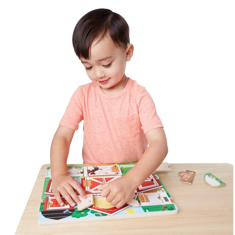 A child on white background with the Melissa & Doug Hide and Seek Farm Wooden Activity Board With Barnyard Animal Magnets