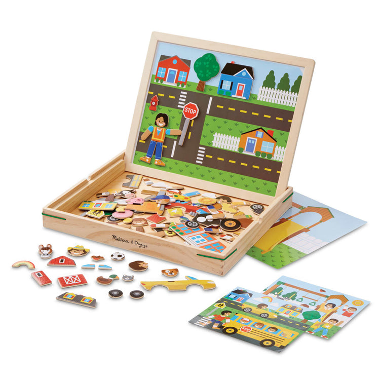The loose pieces of the Melissa & Doug Wooden Magnetic Matching Picture Game With 119 Magnets and Scene Cards
