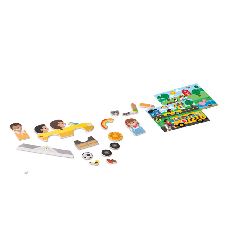 The loose pieces of the Melissa & Doug Wooden Magnetic Matching Picture Game With 119 Magnets and Scene Cards