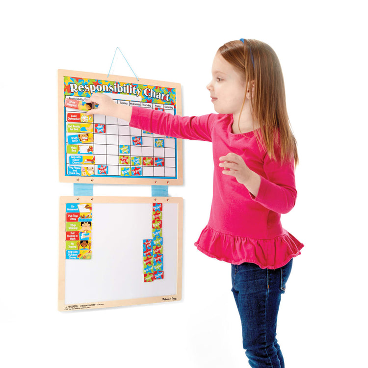 A child on white background with the Melissa & Doug Magnetic Responsibility Chart