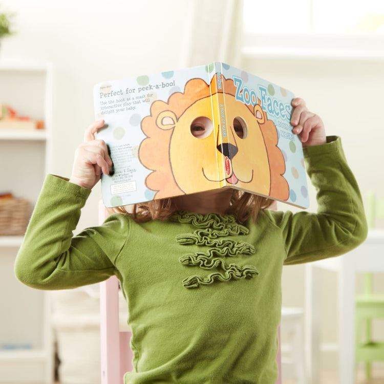 A kid playing with the Mask Book Bundle