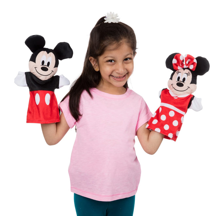 A child on white background with the Mickey Mouse & Friends Soft & Cuddly Hand Puppets