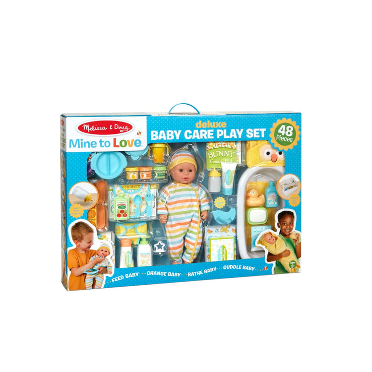 The front of the box for the Melissa & Doug Mine to Love Deluxe Baby Care Play Set (48 Pieces – Doll + Accessories to Feed, Bathe, Change, and Cuddle)