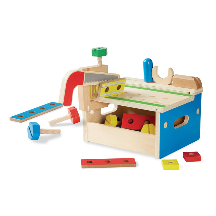 The loose pieces of the Melissa & Doug Hammer and Saw Tool Bench - Wooden Building Set (32 pcs)