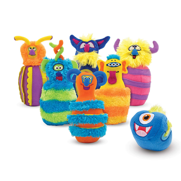 The loose pieces of the Melissa & Doug Fuzzy Monster Bowling Pins & Ball With Mesh Storage Bag (8-Piece Set)