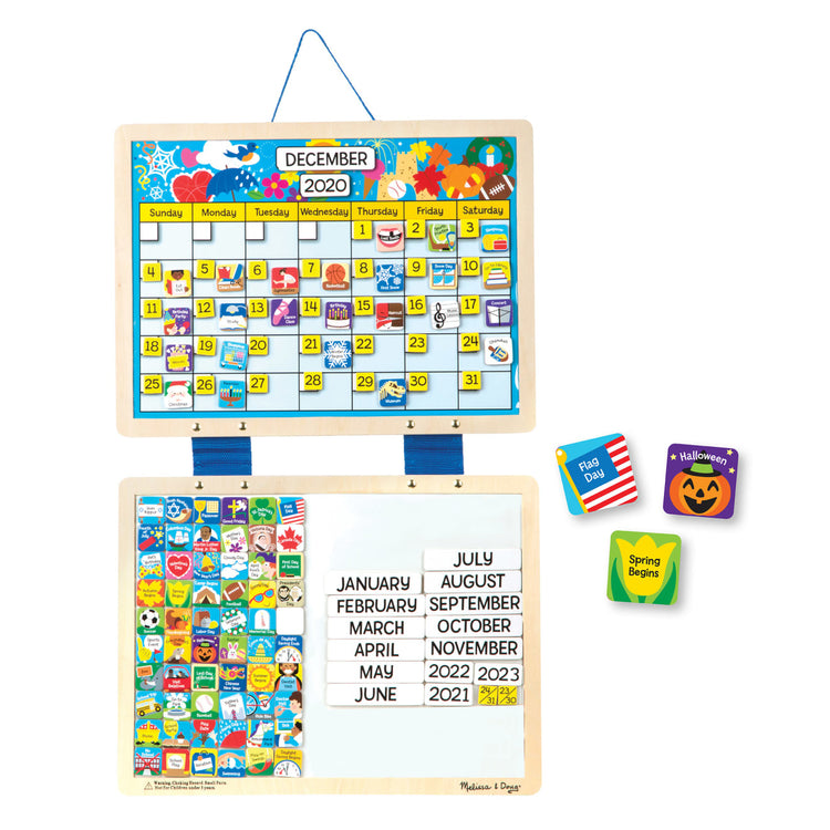 The loose pieces of the Melissa & Doug Monthly Magnetic Calendar With 133 Magnets and 2 Fabric-Hinged Dry-Erase Boards