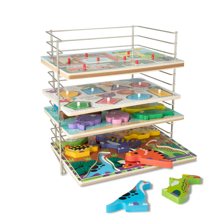 The loose pieces of the Melissa & Doug Multi-Fit Metal Wire Puzzle Rack For Up To a Dozen 12-Inch-Wide, 0.75-Inch Deep Wooden Puzzles