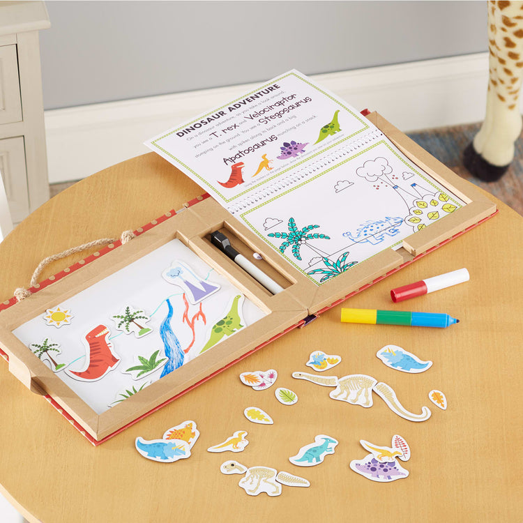 the Melissa & Doug Natural Play: Play, Draw, Create Reusable Drawing & Magnet Kit – Dinosaurs (41 Magnets, 5 Dry-Erase Markers)