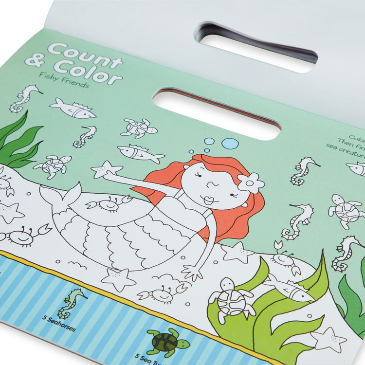 The front of the box for the Melissa & Doug Playmats Enchanted Kingdom Take-Along Paper Coloring And Learning Activity Pads (24 Pages)
