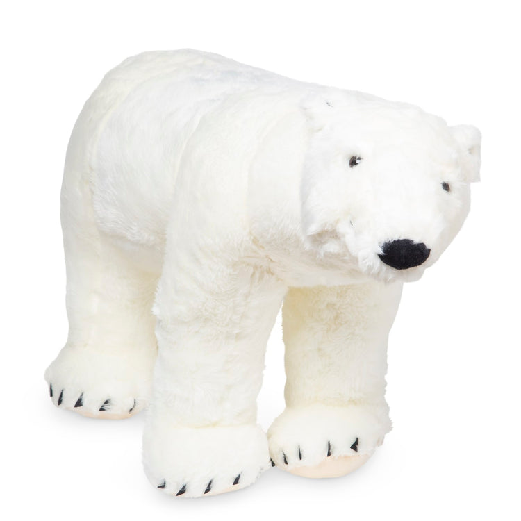 The loose pieces of the Melissa & Doug Giant Polar Bear - Lifelike Stuffed Animal (nearly 3 feet long)