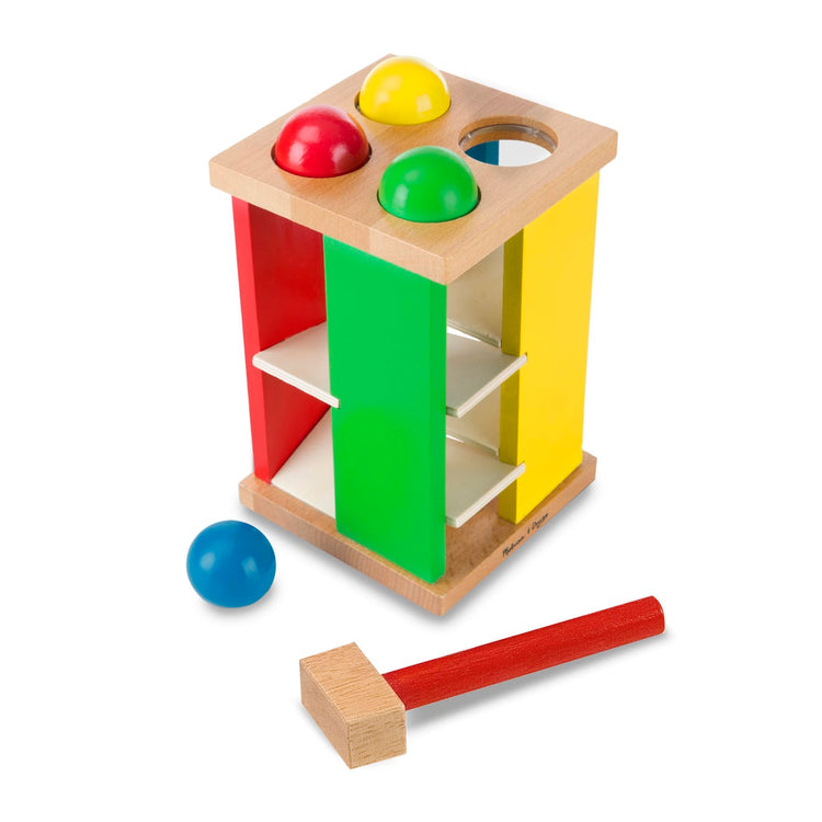 The loose pieces of the Melissa & Doug Deluxe Pound and Roll Wooden Tower Toy With Hammer