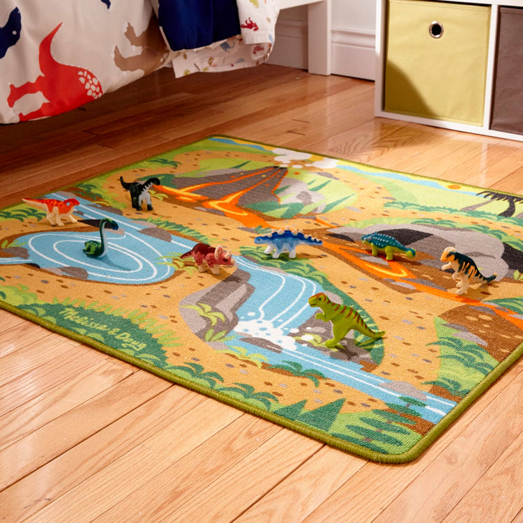 the Melissa & Doug Prehistoric Playground Dinosaur Activity Rug (39 x 36 inches) - 4 Toy Animals
