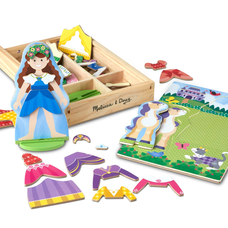 The loose pieces of the Melissa & Doug Princess & Horse Magnetic Dress-Up Wooden Dolls Pretend Play Set (35 pcs)