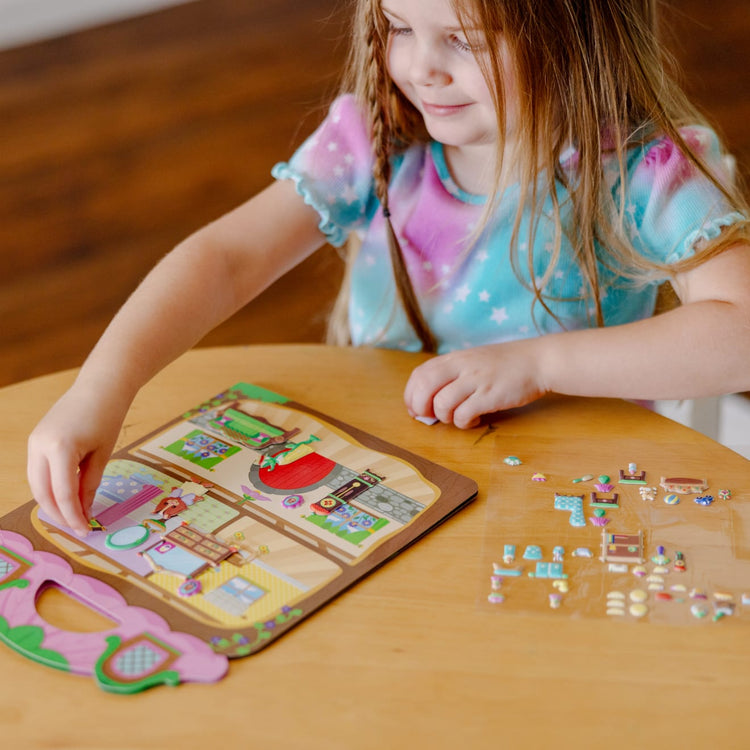 A kid playing with the Melissa & Doug Puffy Sticker Activity Book: Chipmunk House - Safari