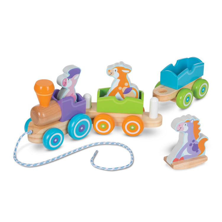 The loose pieces of the Melissa & Doug First Play Wooden Rocking Farm Animals Pull Train