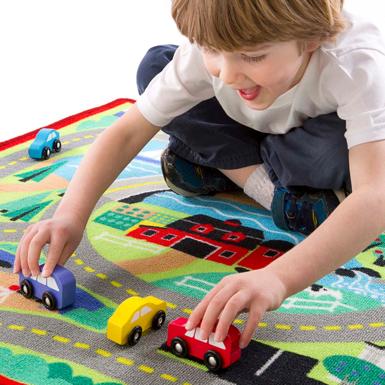 the Melissa & Doug Round the Town Road Rug and Car Activity Play Set With 4 Wooden Cars (39 x 36 inches)