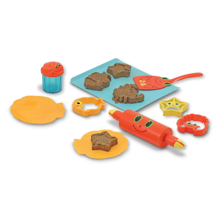 The loose pieces of the Melissa & Doug Sunny Patch Seaside Sidekicks Sand Cookie-Baking Set