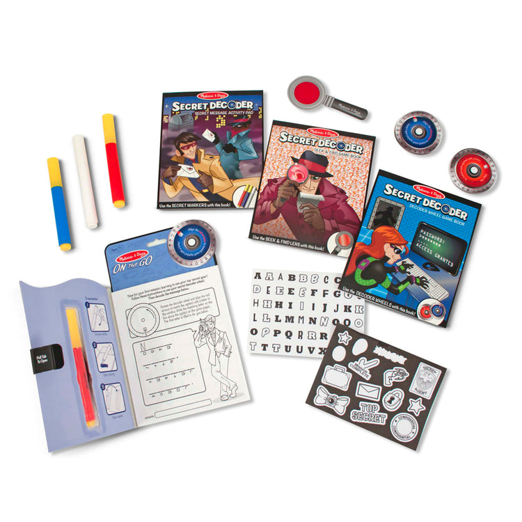 The loose pieces of the Melissa & Doug On the Go Secret Decoder Deluxe Activity Set and Super Sleuth Toy
