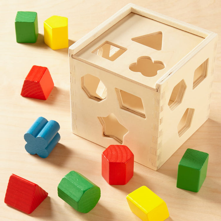 https://www.melissaanddoug.com/cdn/shop/products/Shape-Sorting-Cube-000575-8-Pieces-Out.jpg?v=1666634727&width=750