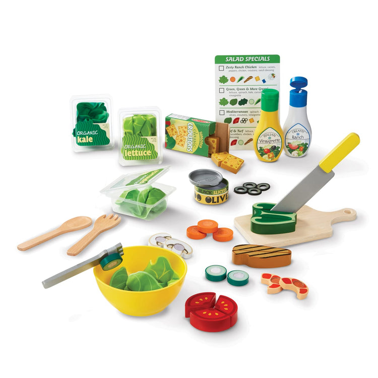 The loose pieces of the Melissa & Doug Slice and Toss Salad Play Food Set – 52 Wooden and Felt Pieces