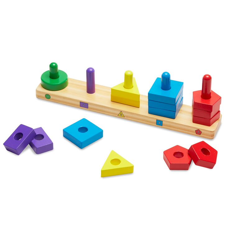 The loose pieces of the Melissa & Doug Stack and Sort Board - Wooden Educational Toy With 15 Solid Wood Pieces