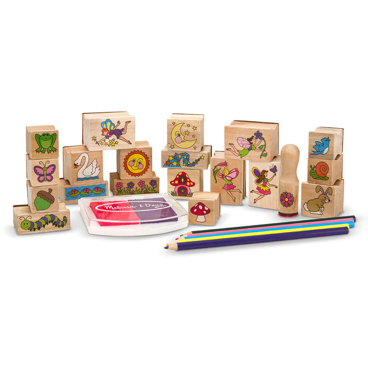 The loose pieces of the Melissa & Doug Stamp-a-Scene Stamp Pad: Fairy Garden - 20 Wooden Stamps, 5 Colored Pencils, and 2-Color Stamp Pad