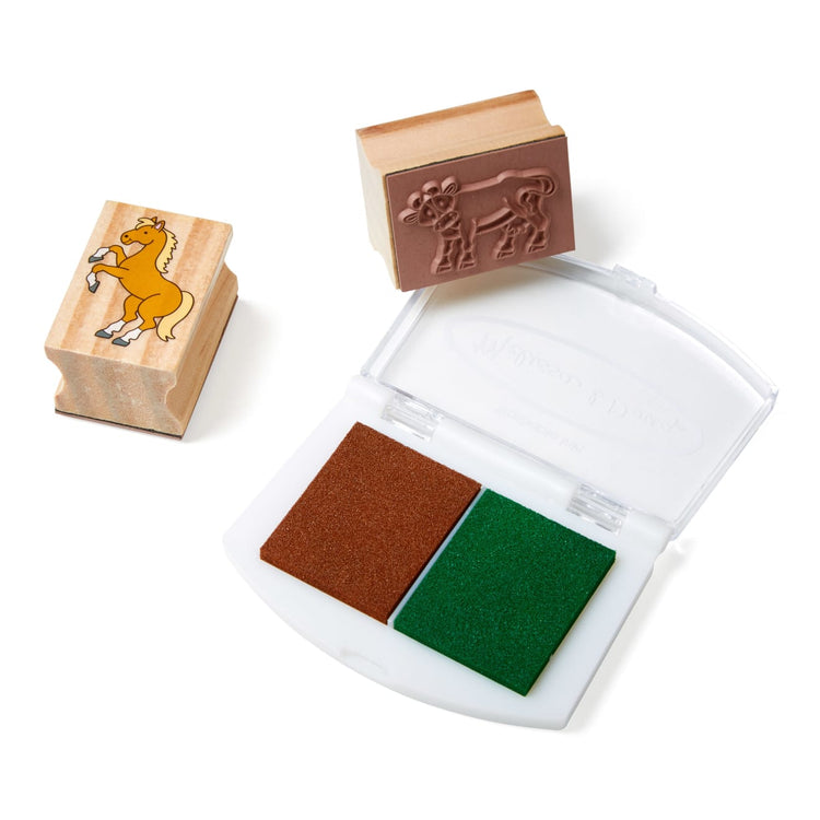 The front of the box for the Melissa & Doug Stamp-a-Scene Wooden Stamp Set: Farm - 20 Stamps, 5 Colored Pencils, and 2-Color Stamp Pad