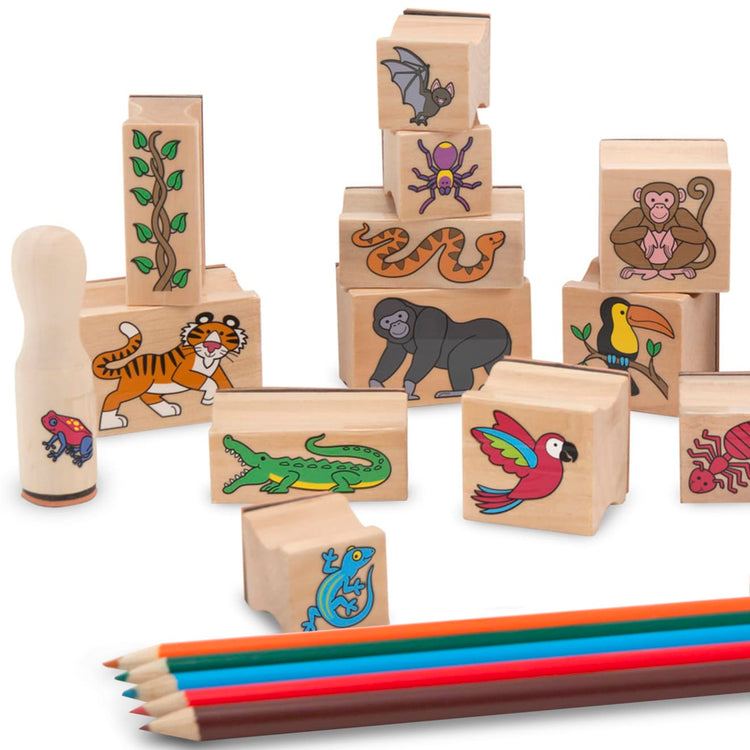 The loose pieces of the Melissa & Doug Stamp-a-Scene Stamp Set: Rain Forest - 20 Wooden Stamps, 5 Colored Pencils, and 2-Color Stamp Pad