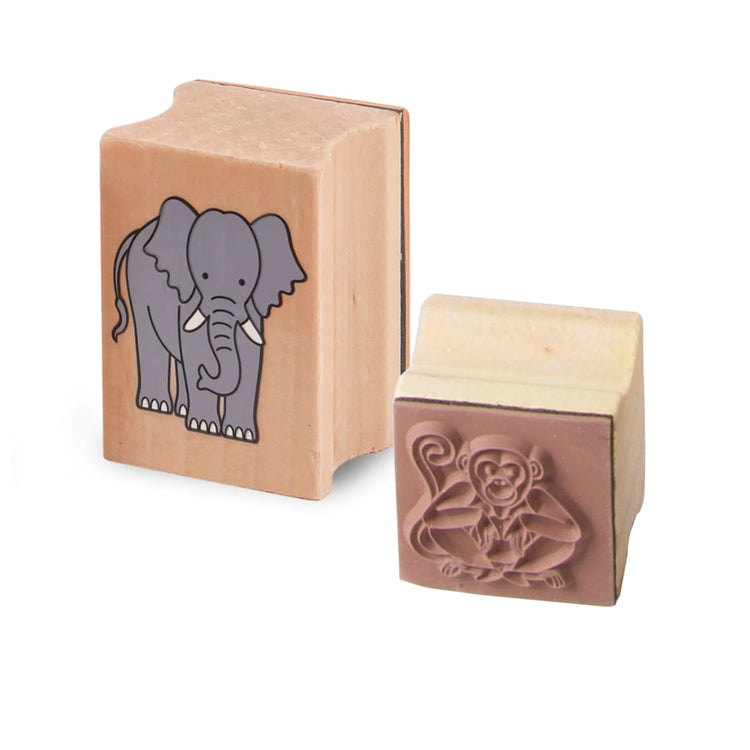 The loose pieces of the Melissa & Doug Stamp-a-Scene Stamp Set: Rain Forest - 20 Wooden Stamps, 5 Colored Pencils, and 2-Color Stamp Pad