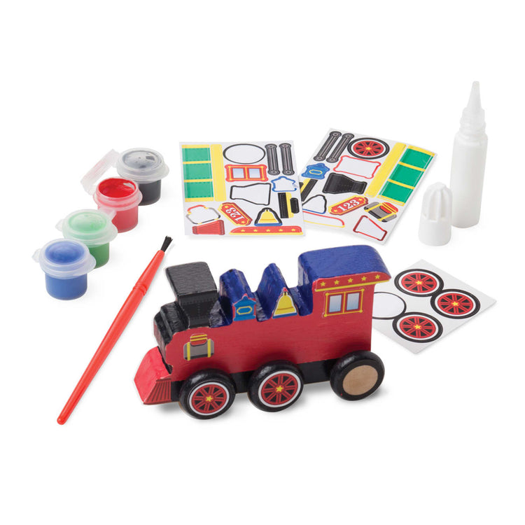 The loose pieces of the Melissa & Doug Train Wooden Craft Kit